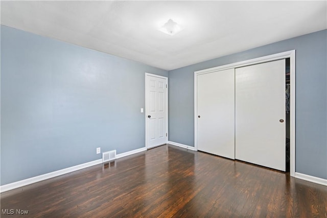 6767 Chippewa Ave NW, North Canton, OH 44720 - unfurnished bedroom featuring wood finished floors and a closet