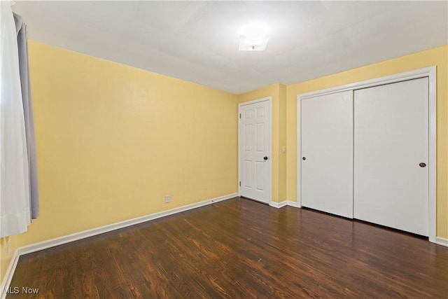 6767 Chippewa Ave NW, North Canton, OH 44720 - unfurnished bedroom featuring wood finished floors and a closet