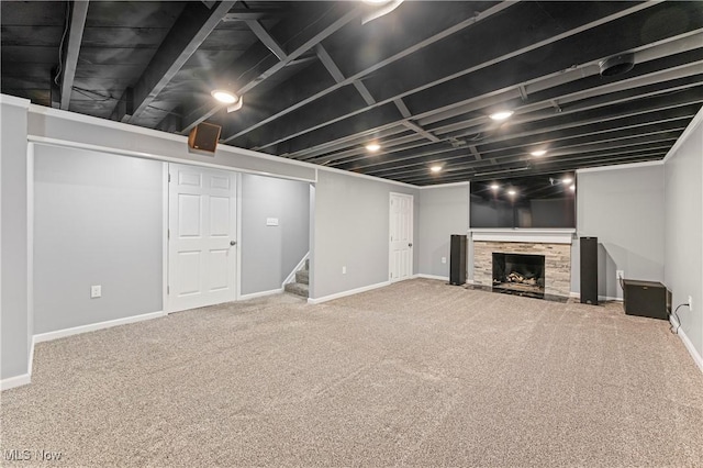 6767 Chippewa Ave NW, North Canton, OH 44720 - finished below grade area featuring carpet flooring, stairs, and a fireplace with flush hearth