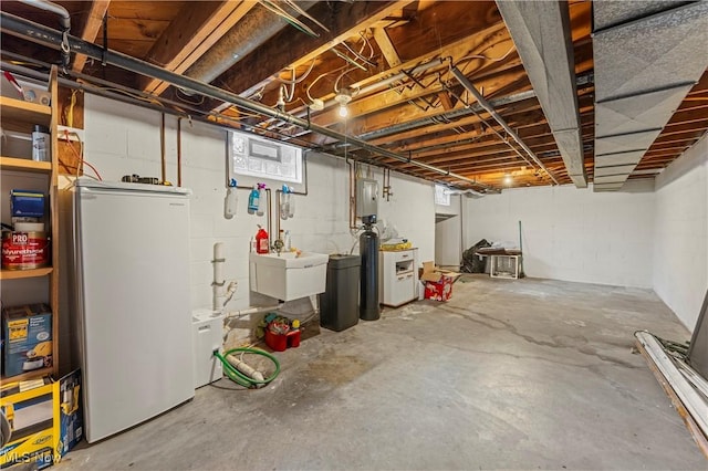 6767 Chippewa Ave NW, North Canton, OH 44720 - unfinished below grade area with refrigerator, electric panel, and a water softener system