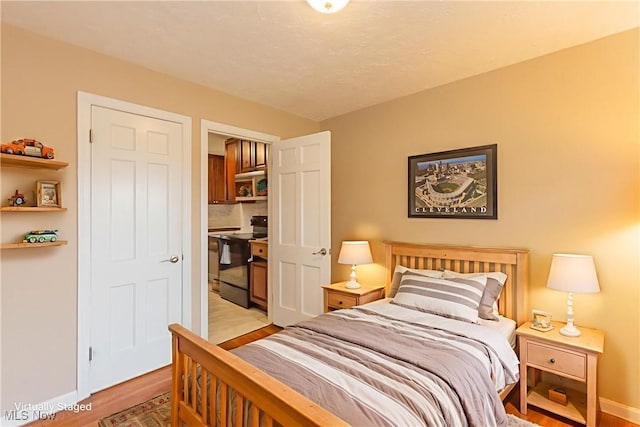 29504 Cresthaven Dr, Willowick, OH 44095 - bedroom with light wood-style floors and a closet