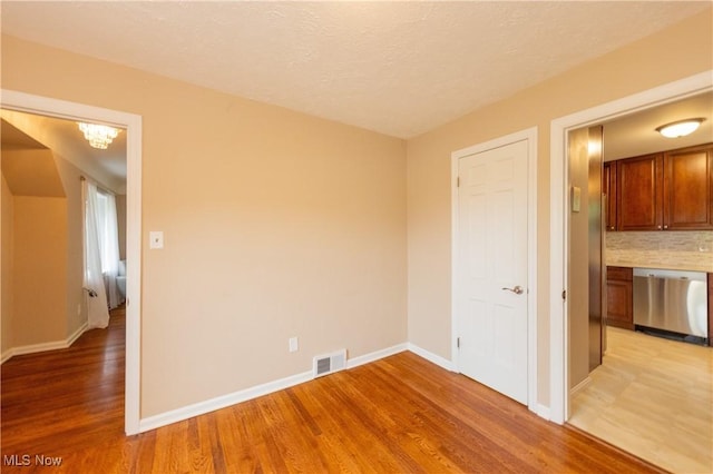 29504 Cresthaven Dr, Willowick, OH 44095 - empty room with light wood-style flooring and baseboards