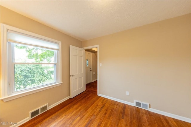 29504 Cresthaven Dr, Willowick, OH 44095 - spare room with wood finished floors and a textured ceiling
