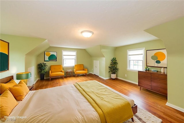 29504 Cresthaven Dr, Willowick, OH 44095 - bedroom with vaulted ceiling and wood finished floors