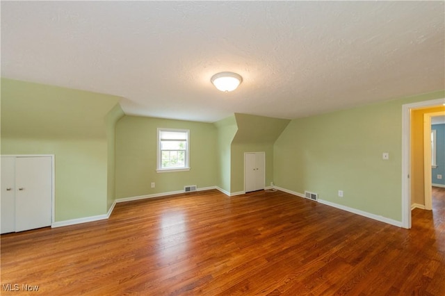 29504 Cresthaven Dr, Willowick, OH 44095 - bonus room with wood finished floors, a textured ceiling, and vaulted ceiling