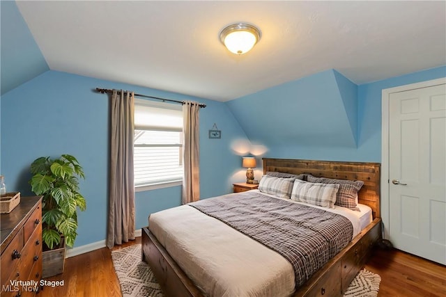 29504 Cresthaven Dr, Willowick, OH 44095 - bedroom with vaulted ceiling and wood finished floors