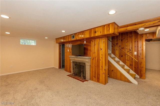 29504 Cresthaven Dr, Willowick, OH 44095 - below grade area with carpet, stairway, wood walls, recessed lighting, and a fireplace with flush hearth