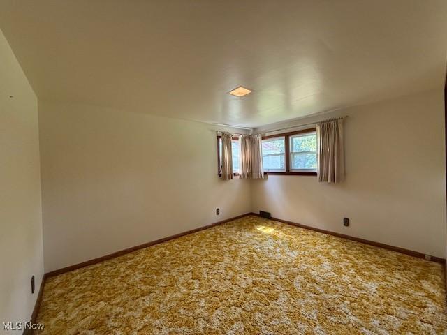 5783 Eagle Creek Rd, Leavittsburg, OH 44430 - spare room featuring baseboards and carpet flooring
