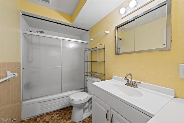 21881 River Oaks Dr Unit C4, Rocky River, OH 44116 - full bath with vanity, combined bath / shower with glass door, and a textured wall