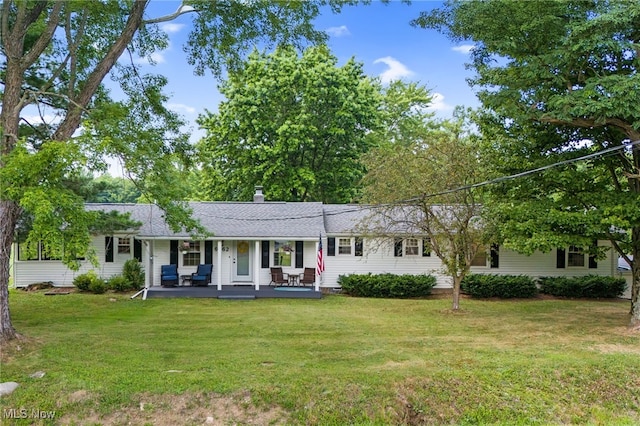 6062 Trask Rd, Thompson, OH 44086 - ranch-style home featuring a porch, a front lawn, and a shingled roof