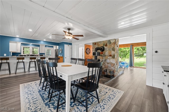 6062 Trask Rd, Thompson, OH 44086 - dining area featuring dark wood-style floors, beam ceiling, and ceiling fan