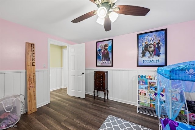 6062 Trask Rd, Thompson, OH 44086 - playroom with dark wood finished floors, wainscoting, and ceiling fan