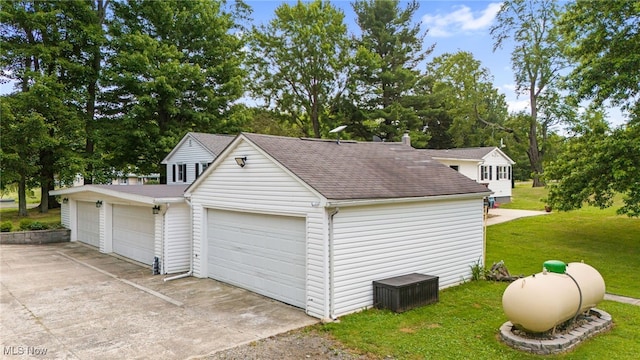 6062 Trask Rd, Thompson, OH 44086 - garage featuring view of scattered trees