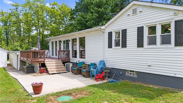 6062 Trask Rd, Thompson, OH 44086 - rear view of house with a deck, a patio area, and a yard