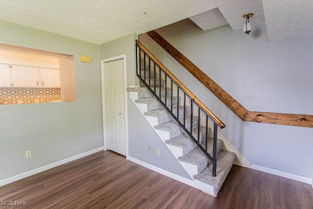 3062 Ivy Hill Cir Unit D, Cortland, OH 44410 - stairs with wood finished floors and a textured ceiling