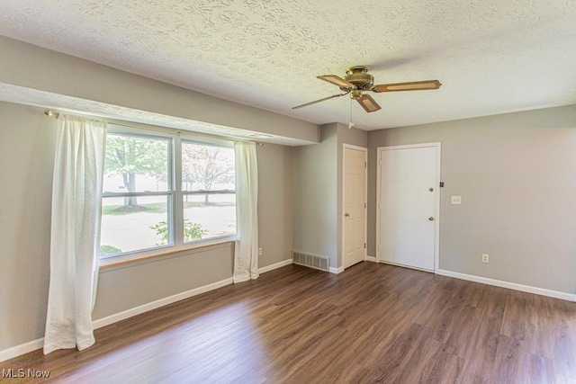 3062 Ivy Hill Cir Unit D, Cortland, OH 44410 - spare room featuring wood finished floors, a ceiling fan, and a textured ceiling