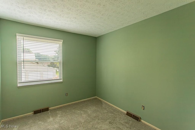 3062 Ivy Hill Cir Unit D, Cortland, OH 44410 - carpeted empty room featuring baseboards and a textured ceiling