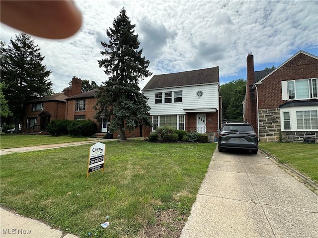 13698 Cedar, University Heights, OH 44118 - view of front of property with a front lawn, concrete driveway, and brick siding