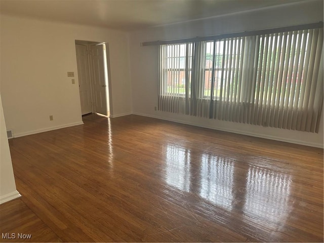 13698 Cedar, University Heights, OH 44118 - empty room with baseboards and wood finished floors