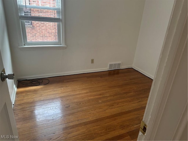 13698 Cedar, University Heights, OH 44118 - spare room featuring wood finished floors and baseboards