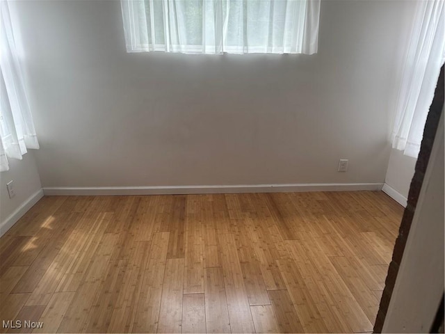13698 Cedar, University Heights, OH 44118 - spare room featuring light wood-type flooring and baseboards