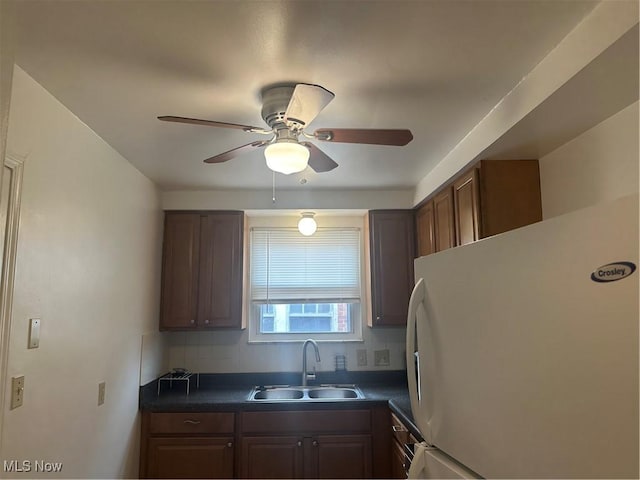 13698 Cedar, University Heights, OH 44118 - kitchen with freestanding refrigerator, dark countertops, ceiling fan, and tasteful backsplash