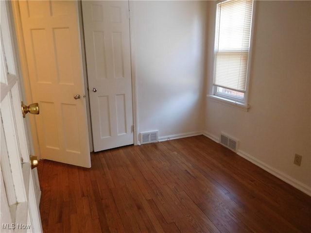 13698 Cedar, University Heights, OH 44118 - unfurnished bedroom featuring wood finished floors and baseboards