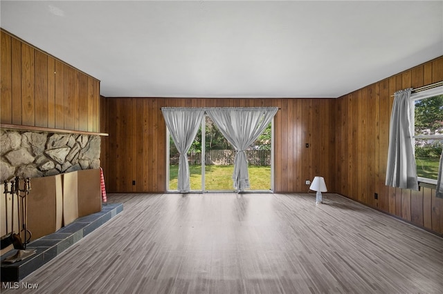 4031 Suffolk Rd, South Euclid, OH 44121 - unfurnished living room featuring wood finished floors and wooden walls