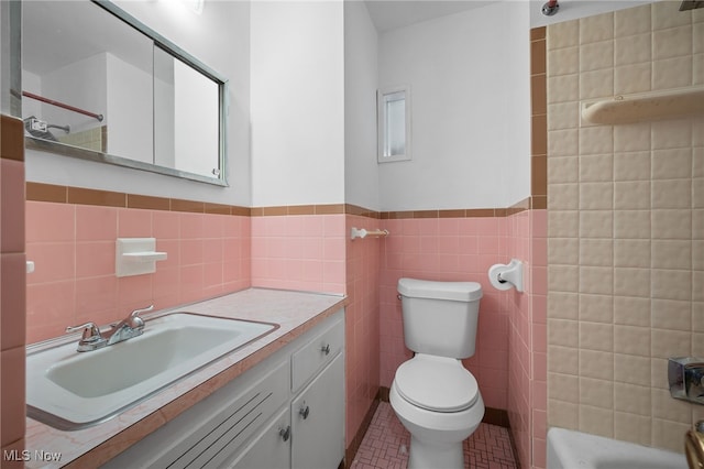 4031 Suffolk Rd, South Euclid, OH 44121 - bathroom with tile walls, vanity, wainscoting, and tile patterned floors