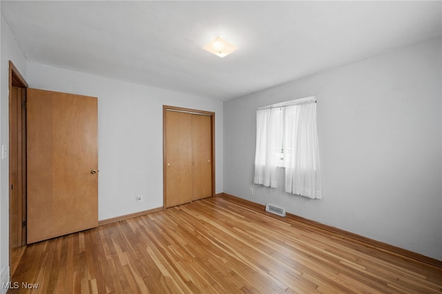 4031 Suffolk Rd, South Euclid, OH 44121 - unfurnished bedroom featuring a closet and light wood-type flooring