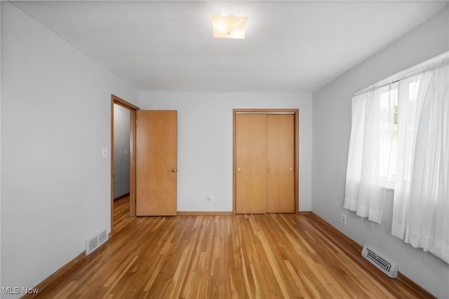 4031 Suffolk Rd, South Euclid, OH 44121 - unfurnished bedroom with light wood-type flooring and a closet