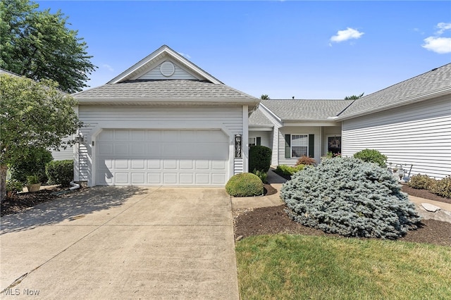 33972 Honeysuckle Ln, North Ridgeville, OH 44039 - single story home with concrete driveway, a garage, and a shingled roof