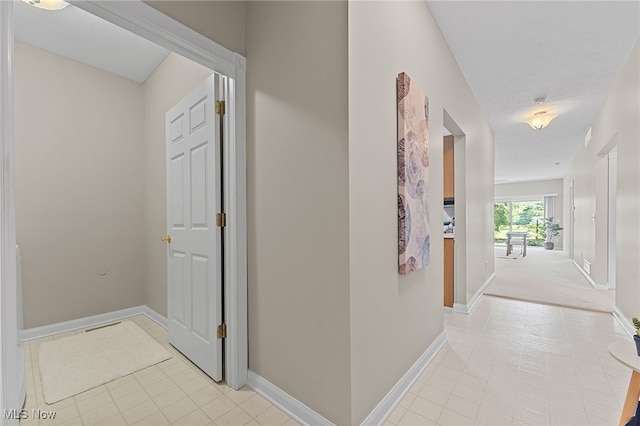 33972 Honeysuckle Ln, North Ridgeville, OH 44039 - hallway with light tile patterned floors