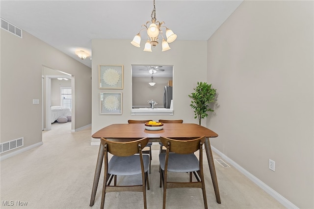 33972 Honeysuckle Ln, North Ridgeville, OH 44039 - dining room with a chandelier and light colored carpet