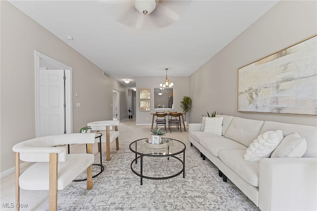 33972 Honeysuckle Ln, North Ridgeville, OH 44039 - living area with light colored carpet, a chandelier, and a ceiling fan
