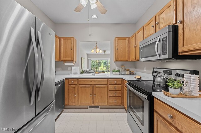 33972 Honeysuckle Ln, North Ridgeville, OH 44039 - kitchen featuring stainless steel appliances, light tile patterned flooring, light countertops, ceiling fan, and recessed lighting