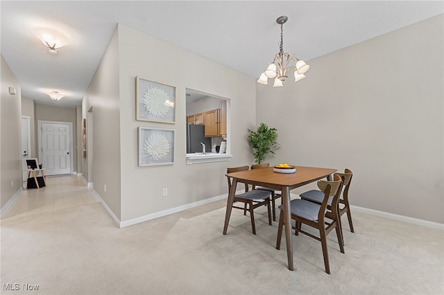 33972 Honeysuckle Ln, North Ridgeville, OH 44039 - dining room featuring a chandelier and light carpet