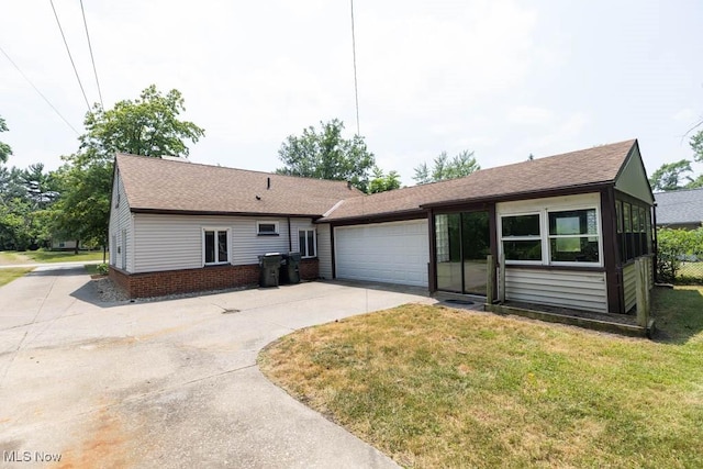 4011 Lancaster Rd, South Euclid, OH 44121 - ranch-style home featuring driveway, a garage, a shingled roof, and a front yard