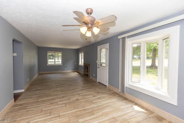 4011 Lancaster Rd, South Euclid, OH 44121 - unfurnished room featuring light wood-type flooring, a textured ceiling, and ceiling fan