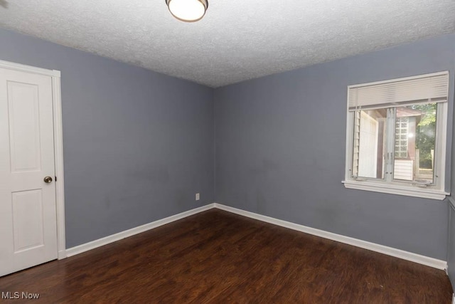 4011 Lancaster Rd, South Euclid, OH 44121 - spare room with dark wood-style flooring and a textured ceiling