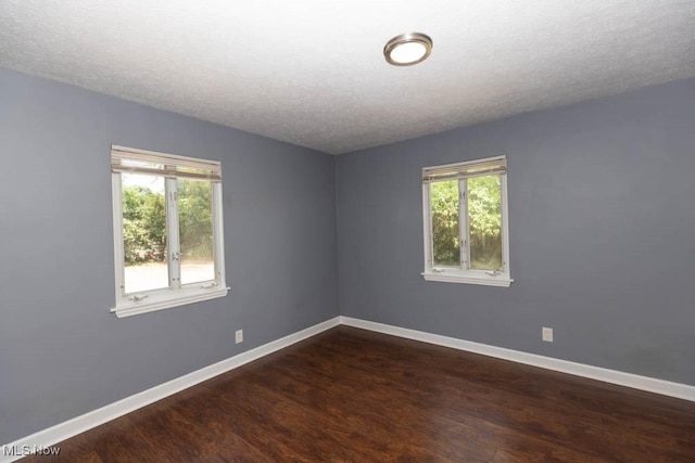 4011 Lancaster Rd, South Euclid, OH 44121 - spare room featuring wood finished floors, healthy amount of natural light, and a textured ceiling
