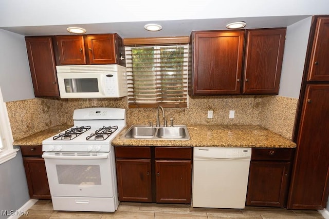 4011 Lancaster Rd, South Euclid, OH 44121 - kitchen featuring white appliances and tasteful backsplash