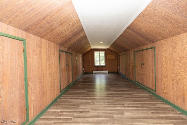 4011 Lancaster Rd, South Euclid, OH 44121 - additional living space featuring lofted ceiling, a baseboard heating unit, wood finished floors, and wood walls