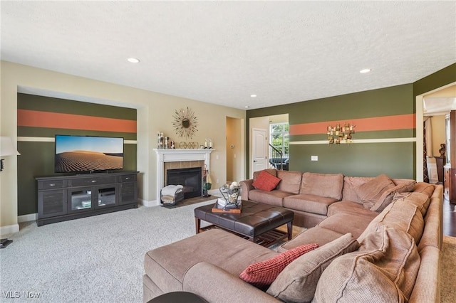 685 Shannon Pl, Aurora, OH 44202 - carpeted living area featuring a tiled fireplace and recessed lighting