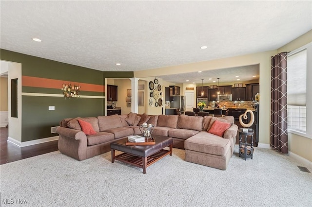 685 Shannon Pl, Aurora, OH 44202 - living room with carpet, ornate columns, and recessed lighting