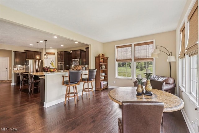 685 Shannon Pl, Aurora, OH 44202 - dining space with dark wood finished floors and recessed lighting