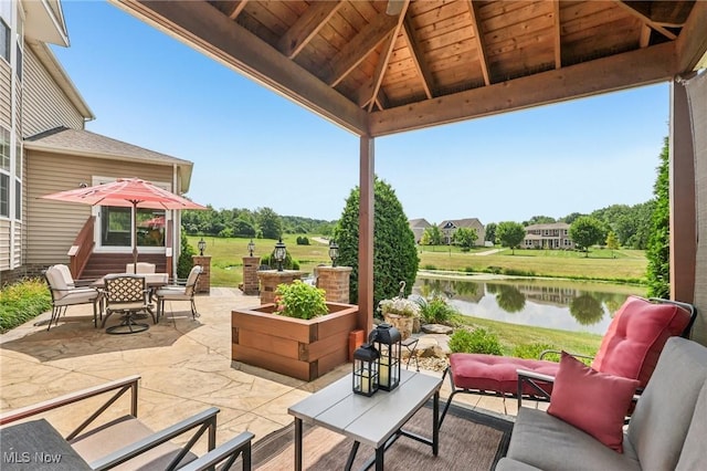 685 Shannon Pl, Aurora, OH 44202 - view of patio featuring an outdoor hangout area, a water view, and outdoor dining area