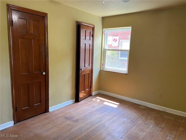 20171 Lake Shore Blvd, Euclid, OH 44123 - unfurnished room with hardwood / wood-style flooring and baseboards