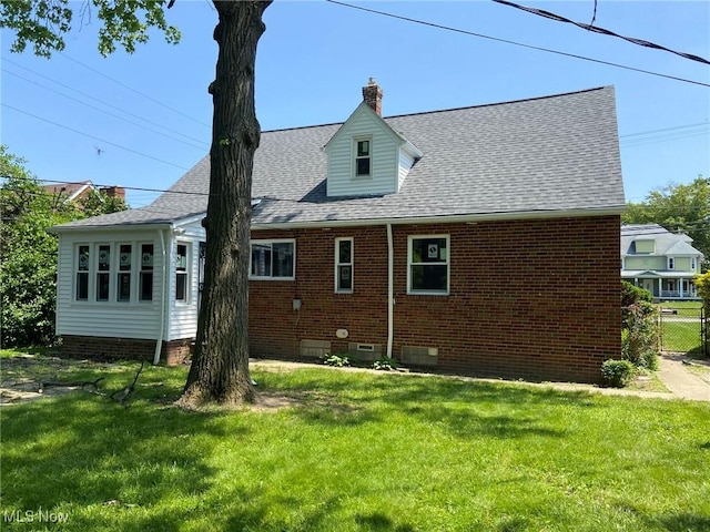 20171 Lake Shore Blvd, Euclid, OH 44123 - rear view of house featuring crawl space, brick siding, a chimney, and a shingled roof