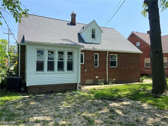 20171 Lake Shore Blvd, Euclid, OH 44123 - rear view of house with crawl space, roof with shingles, and a chimney